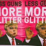 man in black suit jacket and red necktie