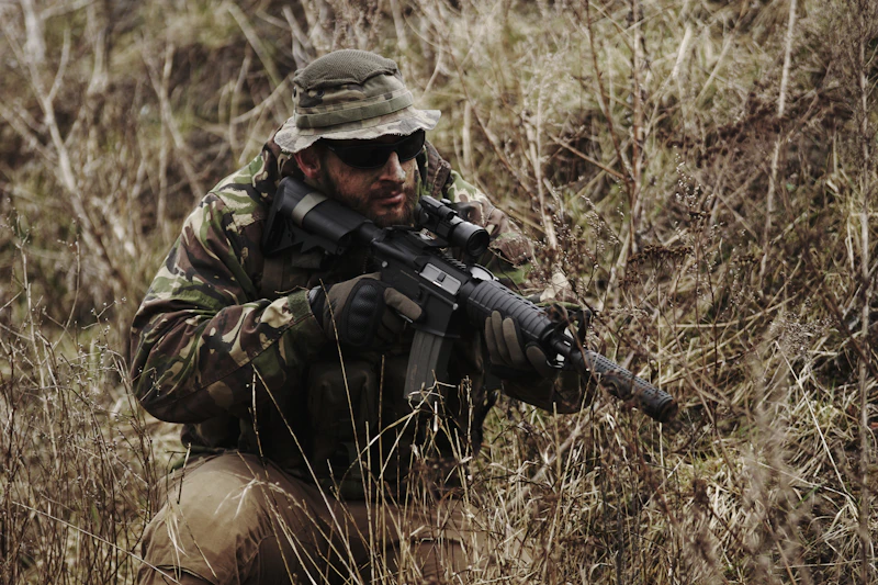 soldier holding black assault rifle