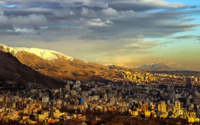 a view of a city with mountains in the background