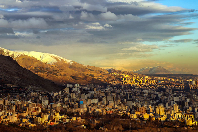 a view of a city with mountains in the background