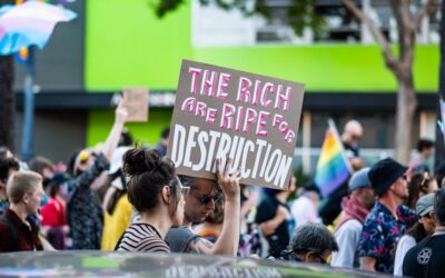 a group of people holding signs