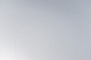 a white wall with water drops on it