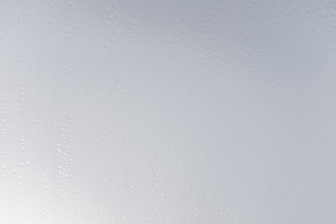 a white wall with water drops on it