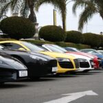 a row of cars parked in a parking lot