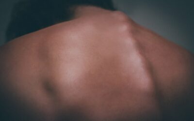 the back of a man with no shirt on