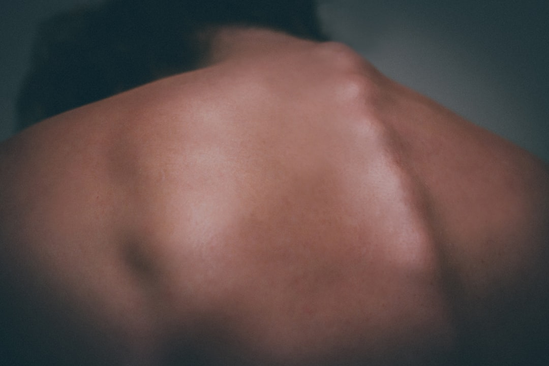 the back of a man with no shirt on