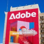 Adobe logo and slogan on a building