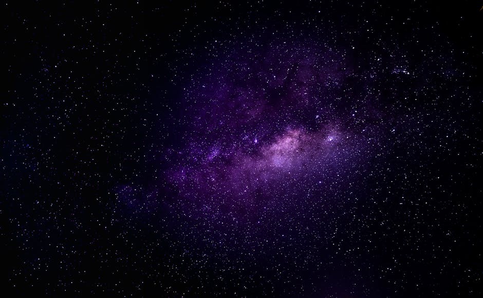 Immersive view of the Milky Way galaxy with vibrant purple hues under a clear night sky.