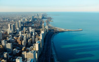 an aerial view of a city and the ocean