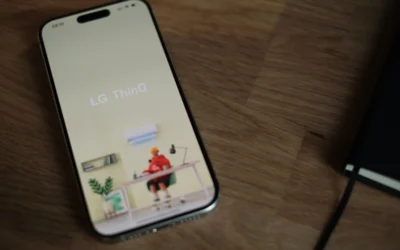 A cell phone sitting on top of a wooden table