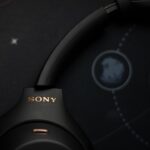 Black sony headphones on a starry background