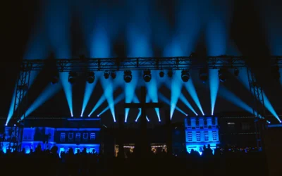 a stage lit up with blue lights at night