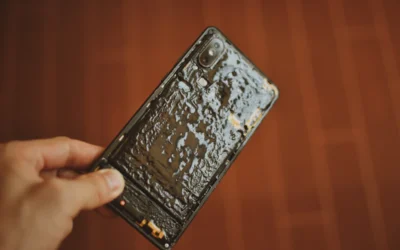 a person holding a cell phone in their hand