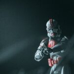 a person in a white and red costume holding a camera