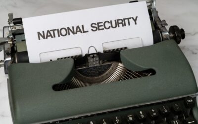 Close-up of a vintage typewriter with a paper marked 'National Security', symbolizing confidentiality.