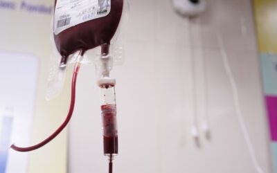 a blood test tube with a blood dropper attached to it