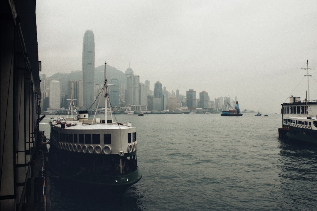 A couple of boats floating on top of a large body of water