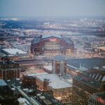 Captivating aerial view of Lucas Oil Stadium and Indianapolis cityscape at dusk.