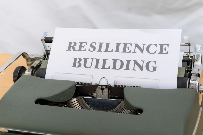 a typewriter with a sign that reads resilince building