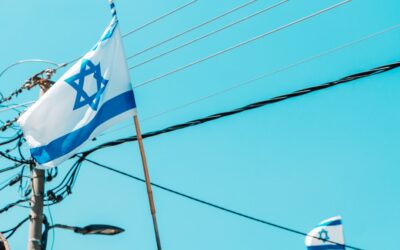 the israeli flag is flying on a pole
