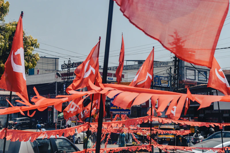 a bunch of flags that are on a pole