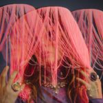 woman wearing pink hats