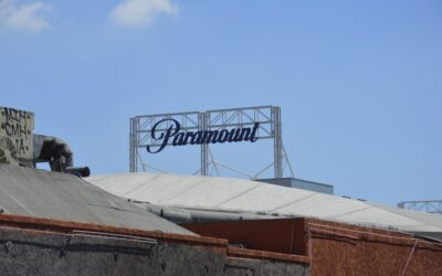 Paramount studios' sign stands against the blue sky.