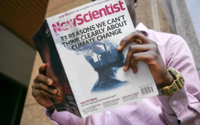 man reading New Scientist book