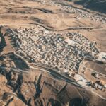 an aerial view of a small town in the desert