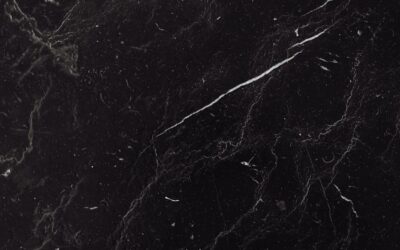 Sophisticated black marble texture with natural veining ideal for backgrounds and design projects.