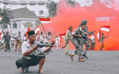 man holding gun during daytime