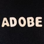 the word adobe spelled with white letters on a black background