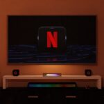 a flat screen tv sitting on top of a entertainment center