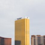 gold-colored Trump high-rise building between of two gold-colored buildings