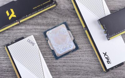 Detailed shot of DDR5 RAM modules and a CPU on a wooden table, highlighting computer hardware.