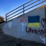 graffiti on the side of a concrete wall