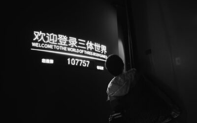 man in white dress shirt sitting on chair