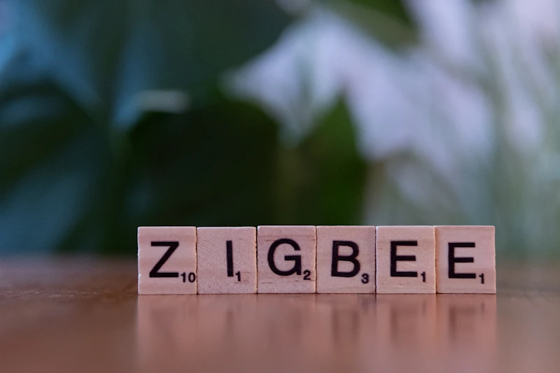 A wooden block spelling zigbee on a table
