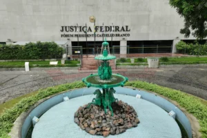 a green fountain in front of a building