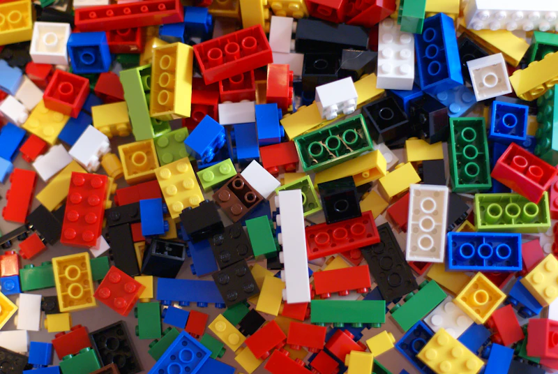 A pile of colorful legos sitting on top of a table