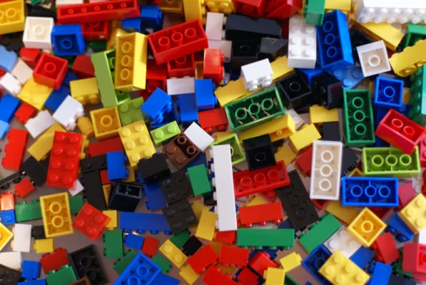 A pile of colorful legos sitting on top of a table