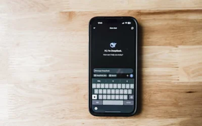 A smartphone on a wooden table showing an AI chatbot interface called DeepSeek.