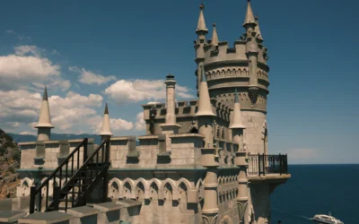 A castle on a cliff overlooking the ocean