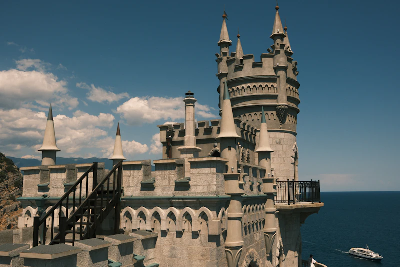 A castle on a cliff overlooking the ocean
