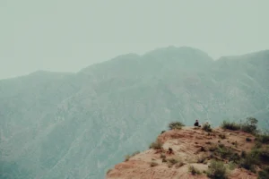 people standing on brown rock mountain during daytime