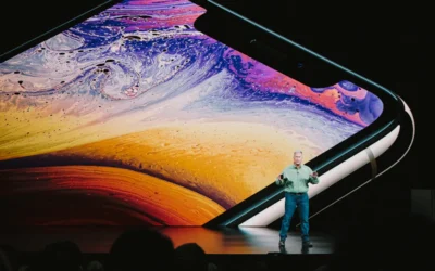 man in white shirt and blue denim jeans standing on blue and yellow water