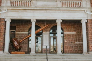 a large wooden object sitting in front of a building