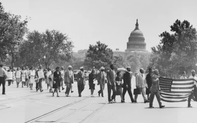 Group of African-Americans, marching near the Capitol building in Washington, D.C., to protest the lynching of four African-Americans in Georgia.