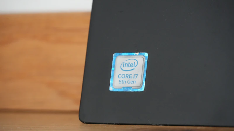 Intel core i7 sticker on a dark surface.