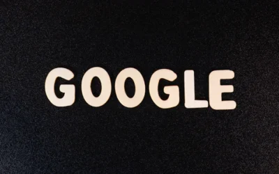 a close up of the word google on a black surface